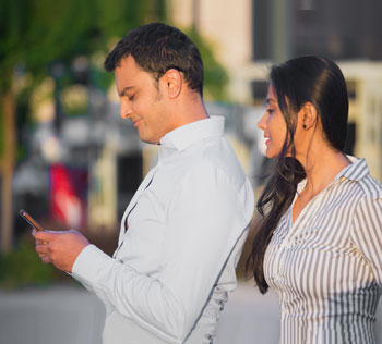 Couple looking at smartphone